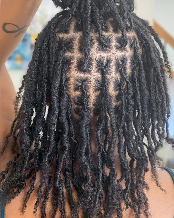 Back of the head showing locs crocheted on a neat square grid